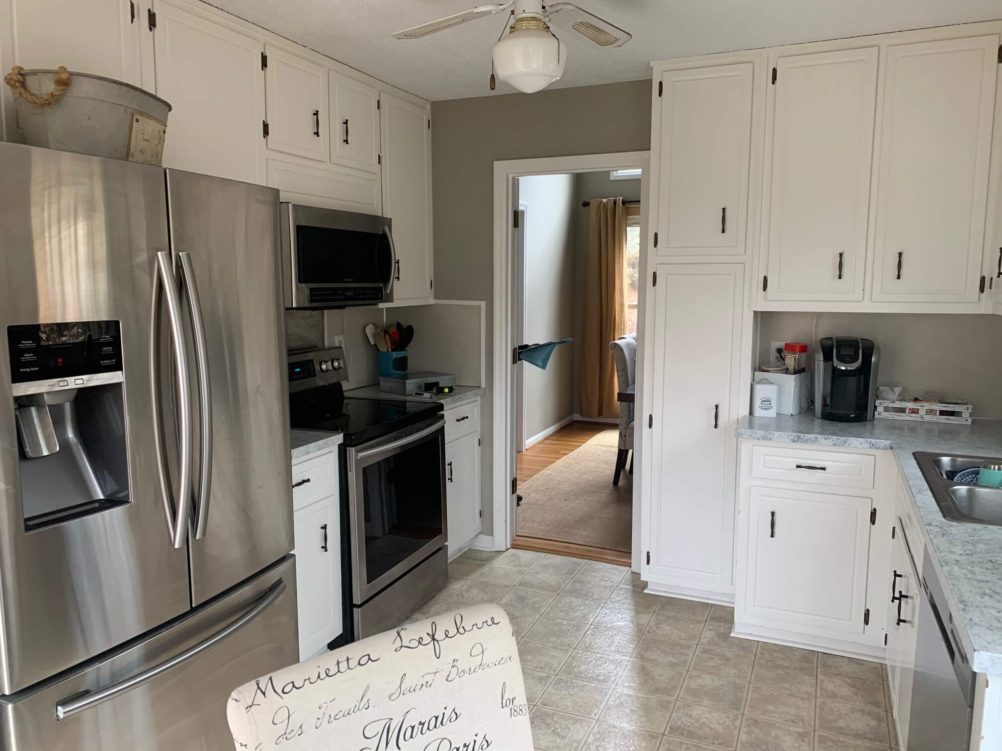 small kitchen with white cabinets