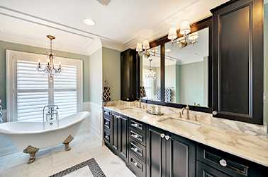 bathroom with dark stained cabinets