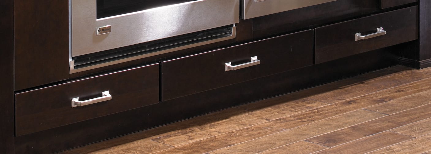 These Dark and Brown cabinets for the 2012, 2011, and 2010 Exhibit Booth home were provided by Wellborn Cabinet, Inc.