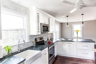 A Medium Density Fiberboard Kitchen featuring Hancock cabinet doors in Glacier from Wellborn Cabinet, Inc.