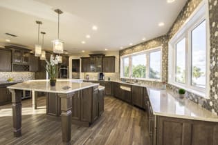 A Maple Kitchen featuring Henlow Square cabinet doors in Drift from Wellborn Cabinet, Inc.