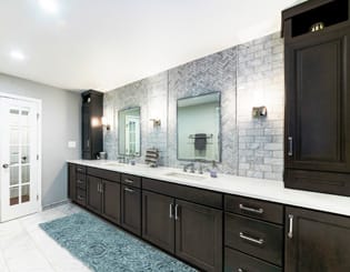 A Maple Bath featuring Millbrook Square cabinet doors in Shadow Charcoal from Wellborn Cabinet, Inc.