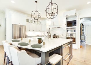 A Maple Kitchen featuring Hanover cabinet doors in Mink Gray from Wellborn Cabinet, Inc.