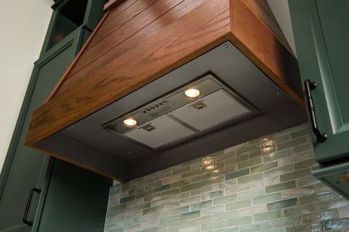These Medium, Brown, and ColorInspire cabinets for the 2020 Exhibit Booth home were provided by Wellborn Cabinet, Inc.