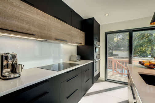 Bel-Air and Midtown is Decorative Laminate Veneer Door door group with a Slab cabinet door from Wellborn Cabinet.