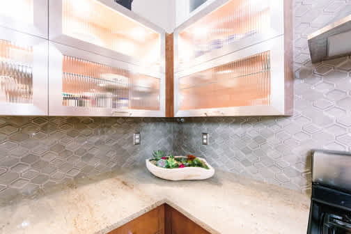 Milan and Sterling is Wood Door and Metal Door door group with a Slab cabinet door from Wellborn Cabinet.