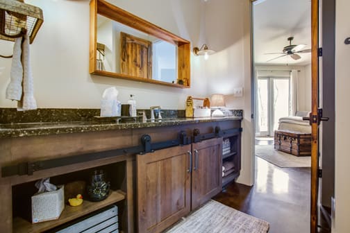 A Character Maple Bath featuring Hanover cabinet doors in Drift from Wellborn Cabinet, Inc.