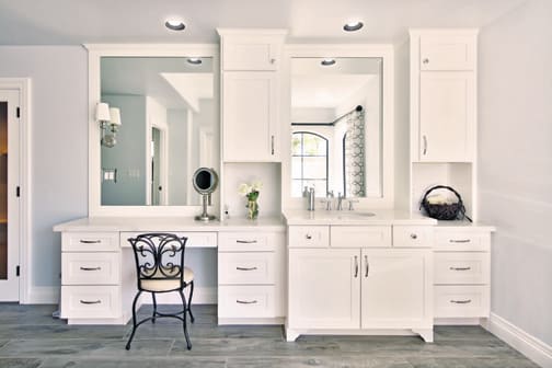 A Maple Bath featuring Hanover cabinet doors in Bright White from Wellborn Cabinet, Inc.