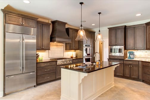 A Maple Kitchen featuring Millbrook Square cabinet doors in Divinity and Drift from Wellborn Cabinet, Inc.