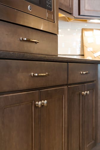 These Medium and Gray cabinets for the 2020 Residential Home, Creative Cabinets & Design, and Cash for Photos home were provided by Wellborn Cabinet, Inc.