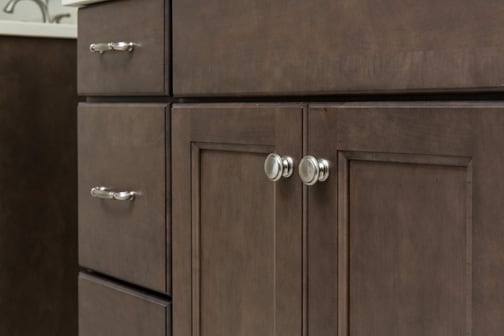 These Gray and Medium cabinets for the 2020 Residential Home, Creative Cabinets & Design, and Cash for Photos home were provided by Wellborn Cabinet, Inc.