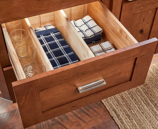 These Brown and Light cabinets for the 2021 Exhibit Booth home were provided by Wellborn Cabinet, Inc.