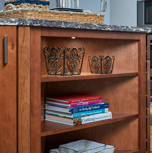These Brown and Light cabinets for the 2021 Exhibit Booth home were provided by Wellborn Cabinet, Inc.