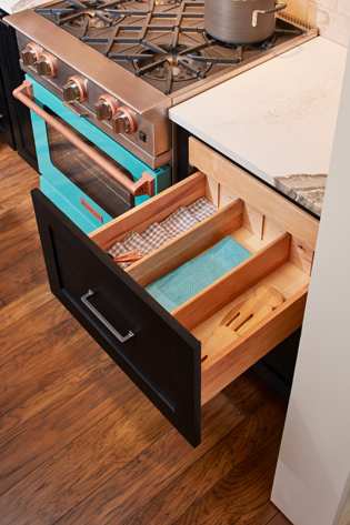 These Dark and Gray cabinets for the 2022 Exhibit Booth home were provided by Wellborn Cabinet, Inc.