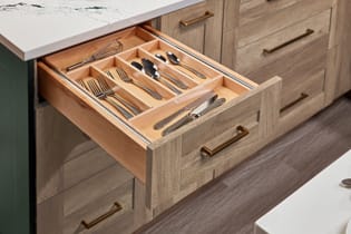 These Brown, Light, and Beige cabinets for the 2022 Exhibit Booth home were provided by Wellborn Cabinet, Inc.