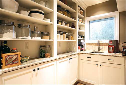 A Maple Pantry featuring Prairie cabinet doors in Divinity from Wellborn Cabinet, Inc.