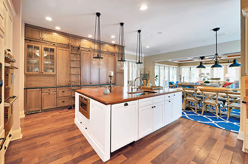 A Maple Kitchen featuring Sonoma cabinet doors in Caramel Java and Glacier from Wellborn Cabinet, Inc.