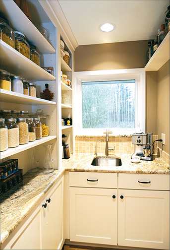A Maple Pantry featuring Prairie cabinet doors in Divinity from Wellborn Cabinet, Inc.