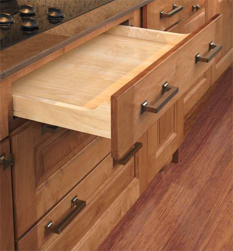 These Brown and Light cabinets for the 2012, 2011, and 2010 Exhibit Booth home were provided by Wellborn Cabinet, Inc.