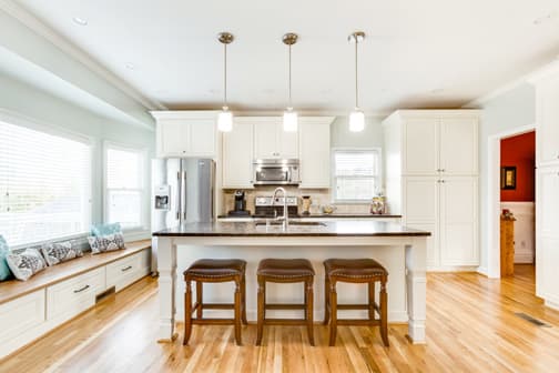 A Medium Density Fiberboard Kitchen featuring Belmont cabinet doors in Glacier from Wellborn Cabinet, Inc.