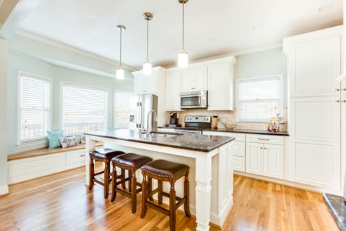 A Medium Density Fiberboard Kitchen featuring Belmont cabinet doors in Glacier from Wellborn Cabinet, Inc.