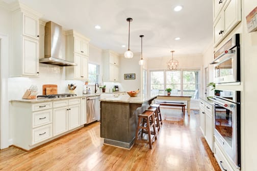 A Maple Kitchen featuring Harmony cabinet doors in Divinity Java and Drift from Wellborn Cabinet, Inc.