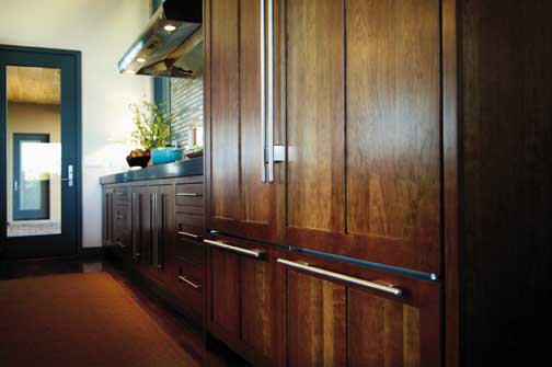 A Cherry Kitchen featuring Hanover Inset cabinet doors in Caramel Java from Wellborn Cabinet, Inc.