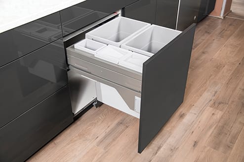 Organize your space with this Wastebasket Cabinet from Wellborn Cabinet