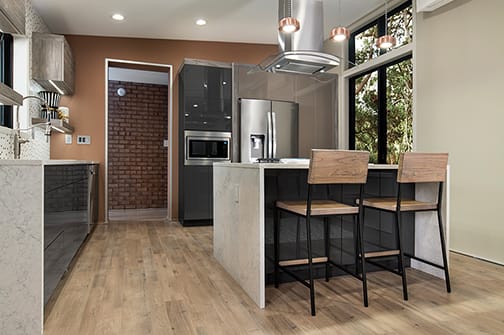 Bel-Air, Midtown, and Vista is Decorative Laminate Veneer Door and Metal Door door group with a Slab cabinet door from Wellborn Cabinet.