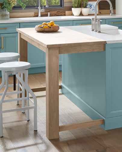 These Brown and Light cabinets for the 2019 Photo Shoot home were provided by Wellborn Cabinet, Inc.