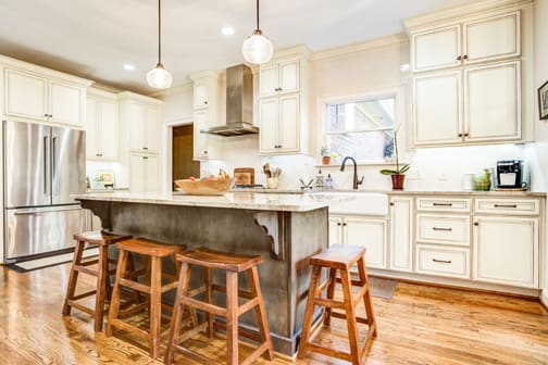 A Maple Kitchen featuring Harmony cabinet doors in Divinity Java and Drift from Wellborn Cabinet, Inc.