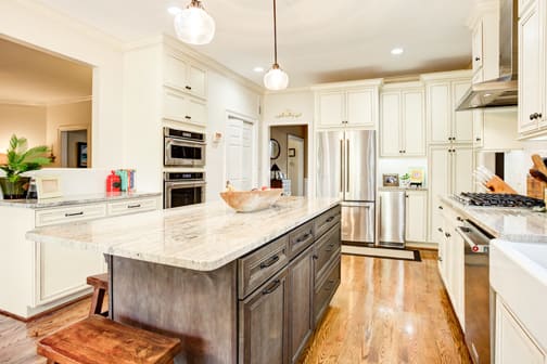 A Maple Kitchen featuring Harmony cabinet doors in Divinity Java and Drift from Wellborn Cabinet, Inc.