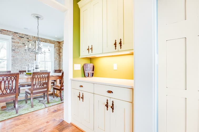 A Character Maple Hutch and Refreshment Areas featuring Hanover cabinet doors in Divinity Java from Wellborn Cabinet, Inc.