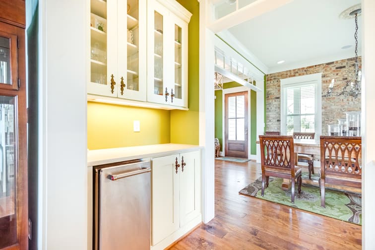 A Character Maple Hutch and Refreshment Areas featuring Hanover cabinet doors in Divinity Java from Wellborn Cabinet, Inc.