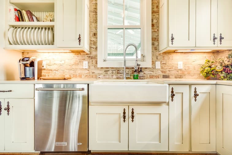 A Character Maple Kitchen featuring Hanover cabinet doors in Divinity Java from Wellborn Cabinet, Inc.