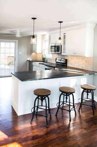 A Medium Density Fiberboard Kitchen featuring Hancock cabinet doors in Glacier from Wellborn Cabinet, Inc.