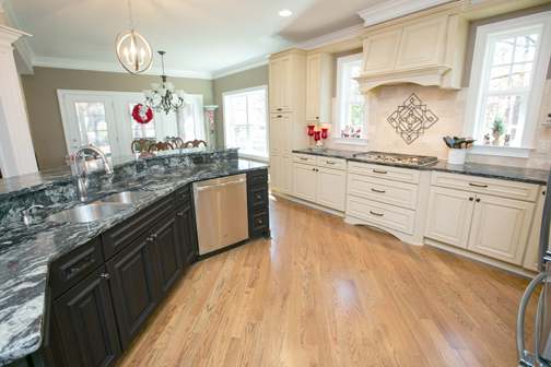 A Maple and Medium Density Fiberboard Kitchen featuring Richmond and Belmont cabinet doors in Sandstone Slate and Shadow from Wellborn Cabinet, Inc.