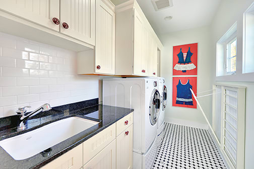 A Maple Laundry Room featuring Harbour cabinet doors in Glacier from Wellborn Cabinet, Inc.