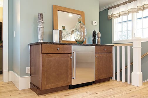 A Maple Hutch and Refreshment Areas featuring Prairie cabinet doors in Sable from Wellborn Cabinet, Inc.