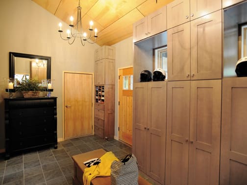 A Maple Mud Room featuring Bristol cabinet doors in Oatmeal Charcoal from Wellborn Cabinet, Inc.