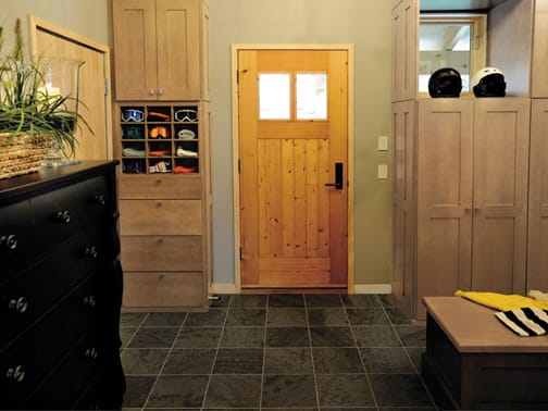 A Maple Mud Room featuring Bristol cabinet doors in Oatmeal Charcoal from Wellborn Cabinet, Inc.