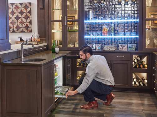 A Hickory Hutch and Refreshment Areas featuring Galena Square cabinet doors in Gauntlet from Wellborn Cabinet, Inc.