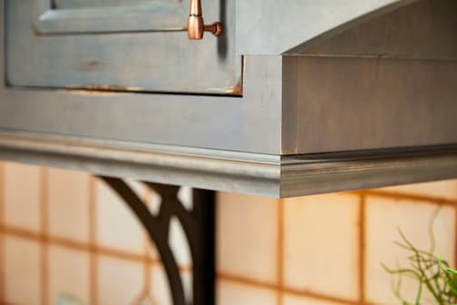 These Dark and Gray cabinets for the 2020 and 2019 Exhibit Booth home were provided by Wellborn Cabinet, Inc.