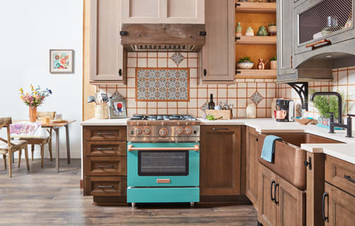 A Maple and Oak Kitchen featuring Sandia, Modesto Inset, and Wellington cabinet doors in Saddle, Gauntlet Java, and Shale from Wellborn Cabinet, Inc.