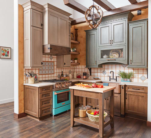 A Maple and Oak Kitchen featuring Sandia, Modesto Inset, and Wellington cabinet doors in Saddle, Gauntlet Java, and Shale from Wellborn Cabinet, Inc.