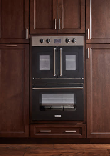 These Brown and Dark cabinets for the 2020 and 2019 Exhibit Booth home were provided by Wellborn Cabinet, Inc.