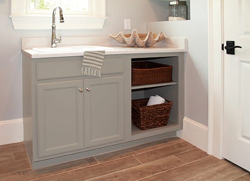 A Maple Bath featuring Arlington Square cabinet doors in Dove from Wellborn Cabinet, Inc.