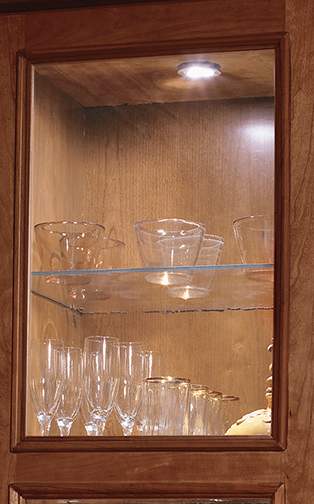 These Medium and Brown cabinets for the 2012 Exhibit Booth home were provided by Wellborn Cabinet, Inc.