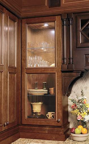 These Medium and Brown cabinets for the 2012, 2011, and 2010 Exhibit Booth home were provided by Wellborn Cabinet, Inc.
