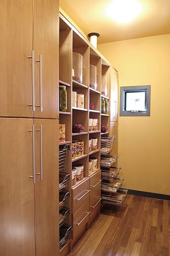 A Maple Pantry featuring Milan cabinet doors in Ginger from Wellborn Cabinet, Inc.